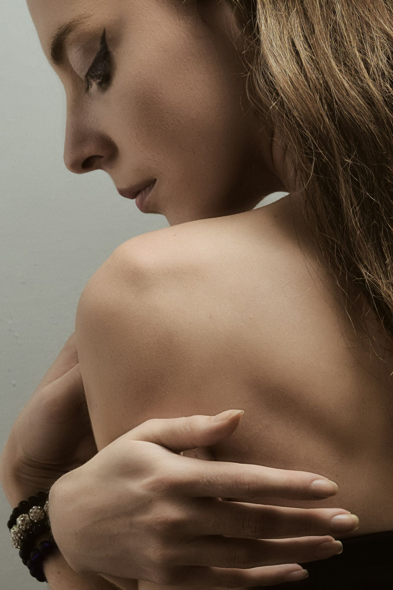 a woman with her arm around her shoulder