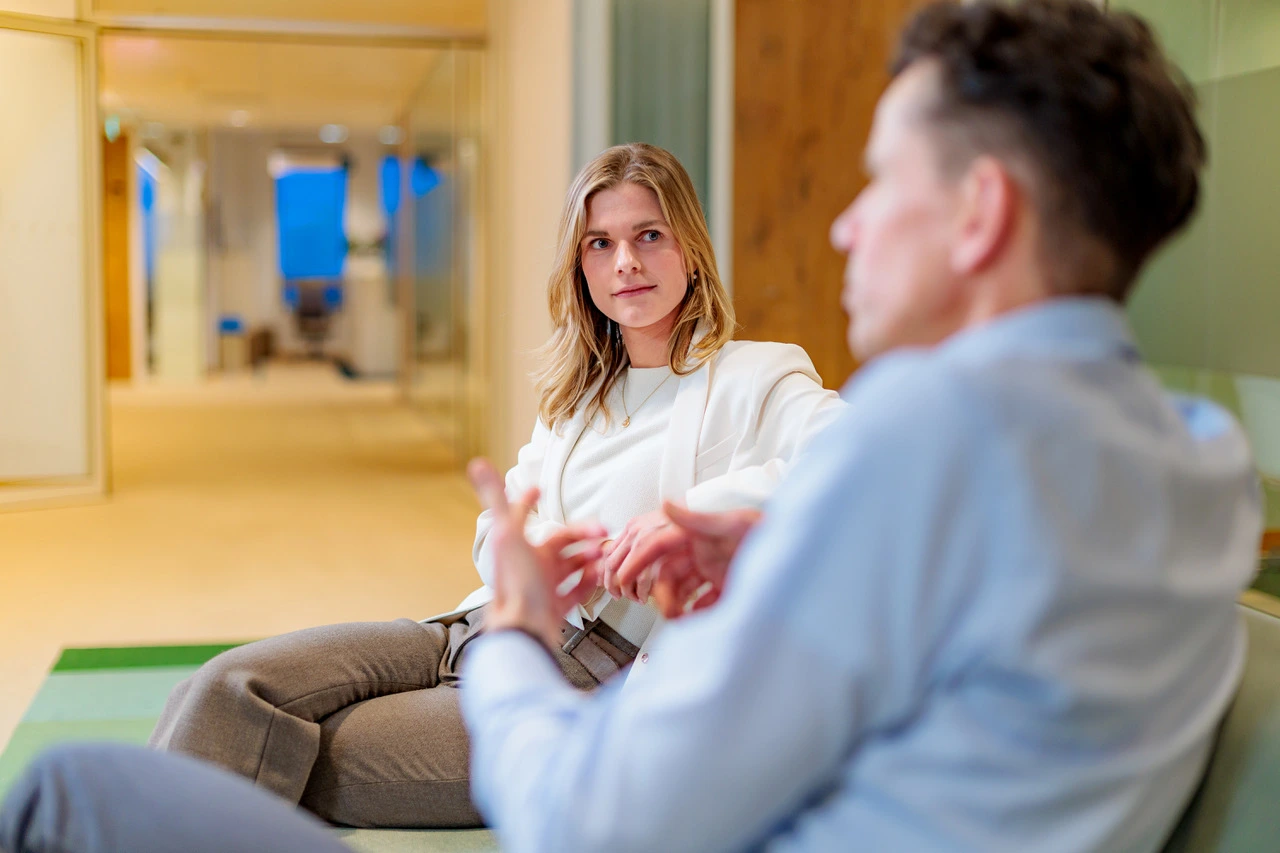 Two people sitting talking