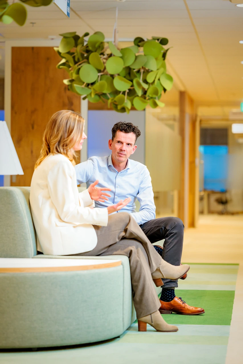 Two people sitting talking